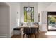 Breakfast nook with built-in bench seating and a farmhouse table at 5328 N 46Th St, Phoenix, AZ 85018