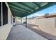 Covered patio with gravel yard and block wall for privacy at 5415 N 79Th Dr, Glendale, AZ 85303