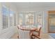 Bright breakfast nook with wooden table and chairs at 5415 N 79Th Dr, Glendale, AZ 85303