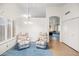 Bright dining area with two armchairs and a view into another room at 5415 N 79Th Dr, Glendale, AZ 85303