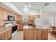 Kitchen boasts granite countertops and wooden cabinetry at 5415 N 79Th Dr, Glendale, AZ 85303