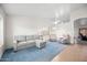 Living room with light grey sectional sofa and blue carpet at 5415 N 79Th Dr, Glendale, AZ 85303