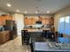 Bright kitchen featuring an island and modern cabinetry at 5744 W Siesta Way, Laveen, AZ 85339