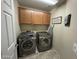 Laundry room with washer, dryer, and cabinets at 5744 W Siesta Way, Laveen, AZ 85339