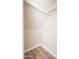 Small closet with white walls and wooden floors at 5855 N 48Th Ave, Glendale, AZ 85301