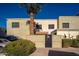 Tan stucco building exterior with gated entry and parking at 5855 N 48Th Ave, Glendale, AZ 85301