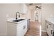 Kitchen with black sink, white cabinets, and dishwasher at 5855 N 48Th Ave, Glendale, AZ 85301