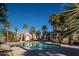 Community pool surrounded by palm trees and desert landscaping at 5855 N 48Th Ave, Glendale, AZ 85301