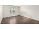 Well-lit bedroom featuring wood floors at 5932 W Holly St, Phoenix, AZ 85035