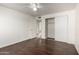 Bright bedroom with wood floors and mirrored closet doors at 5932 W Holly St, Phoenix, AZ 85035