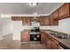 Bright kitchen with stainless steel appliances and ample cabinetry at 5932 W Holly St, Phoenix, AZ 85035