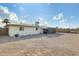 Large backyard with gravel and screened patio at 6702 E Adobe St, Mesa, AZ 85205