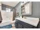 Bathroom with a vanity, bathtub, and window at 6702 E Adobe St, Mesa, AZ 85205