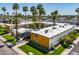 Aerial view of a mid-century modern apartment building with a pool and lush landscaping at 6805 E 2Nd St # 17, Scottsdale, AZ 85251