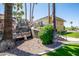 Building exterior showcasing a unique rock waterfall feature and landscaping at 6805 E 2Nd St # 17, Scottsdale, AZ 85251