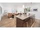 Modern kitchen island with seating overlooking living room at 6805 E 2Nd St # 17, Scottsdale, AZ 85251