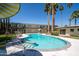 Community pool with surrounding lounge chairs at 6805 E 2Nd St # 17, Scottsdale, AZ 85251