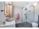 Modern bathroom with a glass shower, stone sink, and floating vanity at 6912 E Larkspur Dr, Scottsdale, AZ 85254