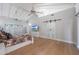 Bright bedroom featuring wood floors and a barn door at 6912 E Larkspur Dr, Scottsdale, AZ 85254