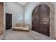 Unique entryway with a rustic wooden door and brick floor at 6912 E Larkspur Dr, Scottsdale, AZ 85254