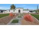 Stunning contemporary home with landscaped front yard and attractive walkway at 6912 E Larkspur Dr, Scottsdale, AZ 85254