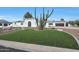 Landscaped yard with artificial turf and modern home at 6912 E Larkspur Dr, Scottsdale, AZ 85254