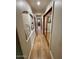 Long hallway with hardwood floors and recessed lighting at 6912 E Larkspur Dr, Scottsdale, AZ 85254