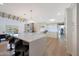 Modern kitchen with white cabinetry, quartz countertops, and breakfast bar at 6912 E Larkspur Dr, Scottsdale, AZ 85254