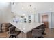 Large kitchen island with seating for four and white quartz countertops at 6912 E Larkspur Dr, Scottsdale, AZ 85254