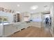 Modern kitchen with white cabinets, farmhouse sink, and hardwood floors at 6912 E Larkspur Dr, Scottsdale, AZ 85254