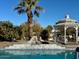 Relaxing pool area with gazebo, waterfall feature, and palm trees at 6912 E Larkspur Dr, Scottsdale, AZ 85254