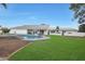 Inviting backyard oasis featuring a sparkling pool and lawn at 6912 E Larkspur Dr, Scottsdale, AZ 85254