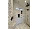 Spa-like shower with multiple shower heads and stone walls at 6912 E Larkspur Dr, Scottsdale, AZ 85254