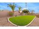 Landscaped backyard with artificial turf and a low wall at 747 E Nolan Pl, Chandler, AZ 85249