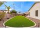 Artificial turf backyard with exterior access to home at 747 E Nolan Pl, Chandler, AZ 85249