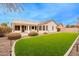 Backyard with grassy area and home exterior at 747 E Nolan Pl, Chandler, AZ 85249