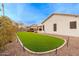 Backyard view showing artificial turf and home exterior at 747 E Nolan Pl, Chandler, AZ 85249