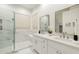 Elegant bathroom with double vanity, large mirror, and walk-in shower at 747 E Nolan Pl, Chandler, AZ 85249