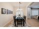 Elegant dining room with a modern chandelier and a large table for entertaining at 747 E Nolan Pl, Chandler, AZ 85249