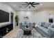 Spacious living room with gray sofas and a large TV at 747 E Nolan Pl, Chandler, AZ 85249