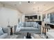 Living room with gray sofas and a view into the kitchen at 747 E Nolan Pl, Chandler, AZ 85249