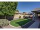 Landscaped backyard with artificial turf and gazebo at 7934 W Andrea Dr, Peoria, AZ 85383