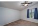 Bright bedroom with a window and navy blue curtains at 7934 W Andrea Dr, Peoria, AZ 85383