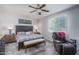 Main bedroom with plush carpet, large window, and a relaxing atmosphere at 7934 W Andrea Dr, Peoria, AZ 85383