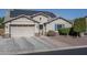 House exterior with solar panels and landscaped yard at 7934 W Andrea Dr, Peoria, AZ 85383