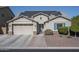 One-story home with solar panels, attached garage, and landscaped yard at 7934 W Andrea Dr, Peoria, AZ 85383