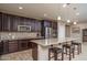 Modern kitchen with island, stainless steel appliances, and tile flooring at 7934 W Andrea Dr, Peoria, AZ 85383