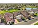 Aerial view of a single-story home with tile roof near a green golf course at 8243 E Cortez Dr, Scottsdale, AZ 85260