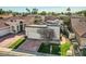 Wide front exterior of a single-story home with mature landscaping and a driveway at 8243 E Cortez Dr, Scottsdale, AZ 85260