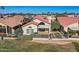 Single-story home with desert landscaping, rod iron fence and a red tile roof at 8243 E Cortez Dr, Scottsdale, AZ 85260